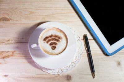 Wifi logo made of cinnamon on cappuccino