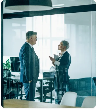 Two people in a meeting room