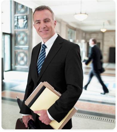 a manager in a suit holding files